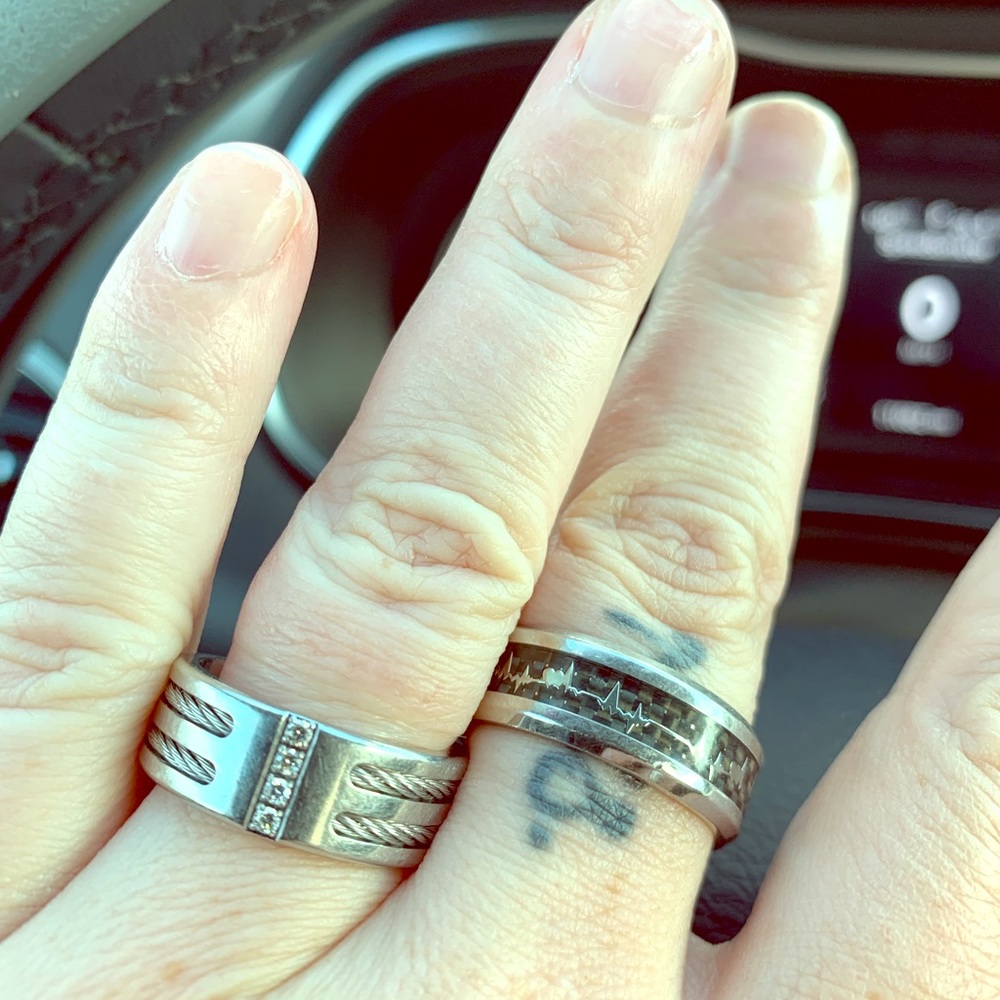 Stainless rings one with four tiny diamonds.